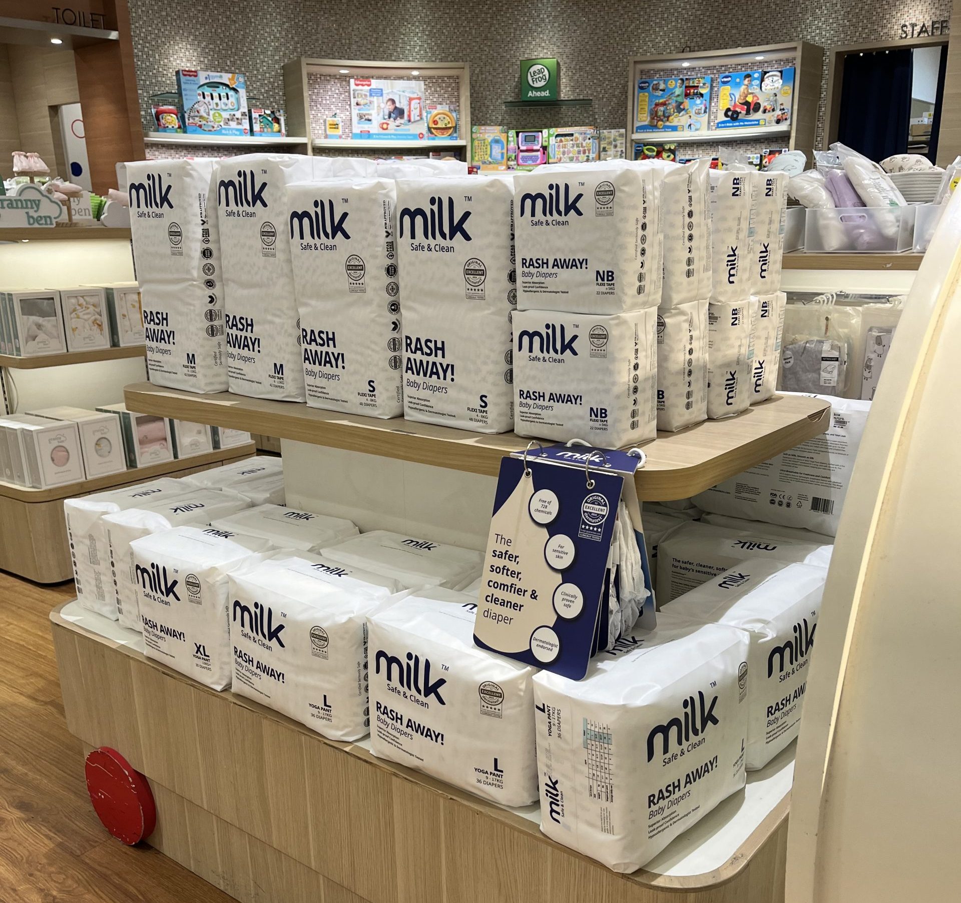 Baby diapers products on shelves in baby store