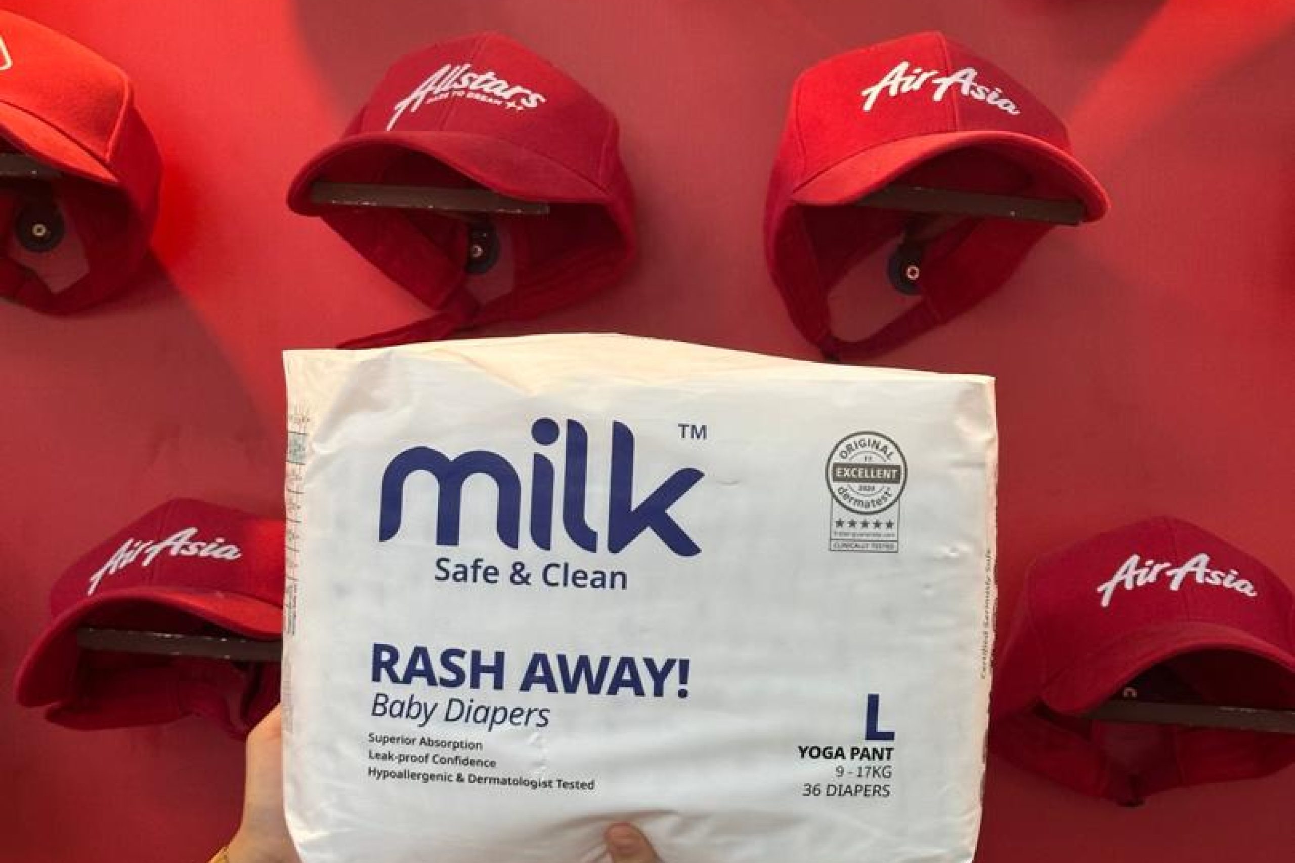 A white diaper packaging with a red background
