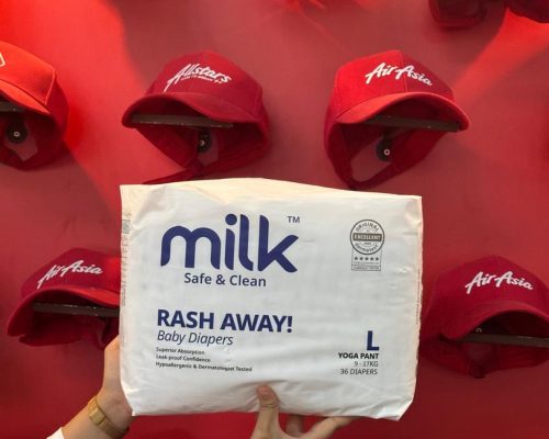 A white diaper packaging with a red background