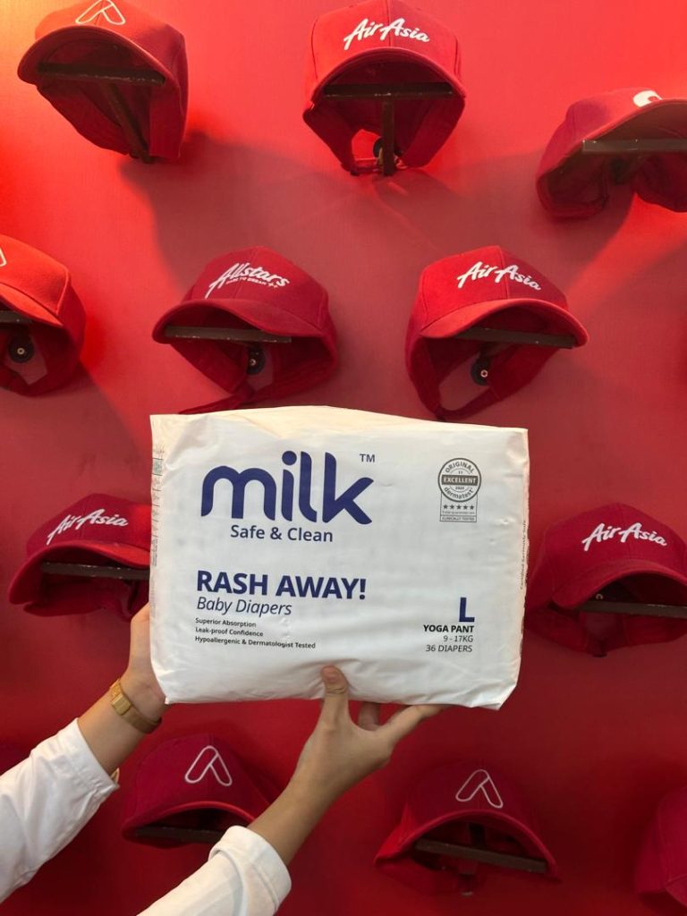 A white diaper packaging with a red background