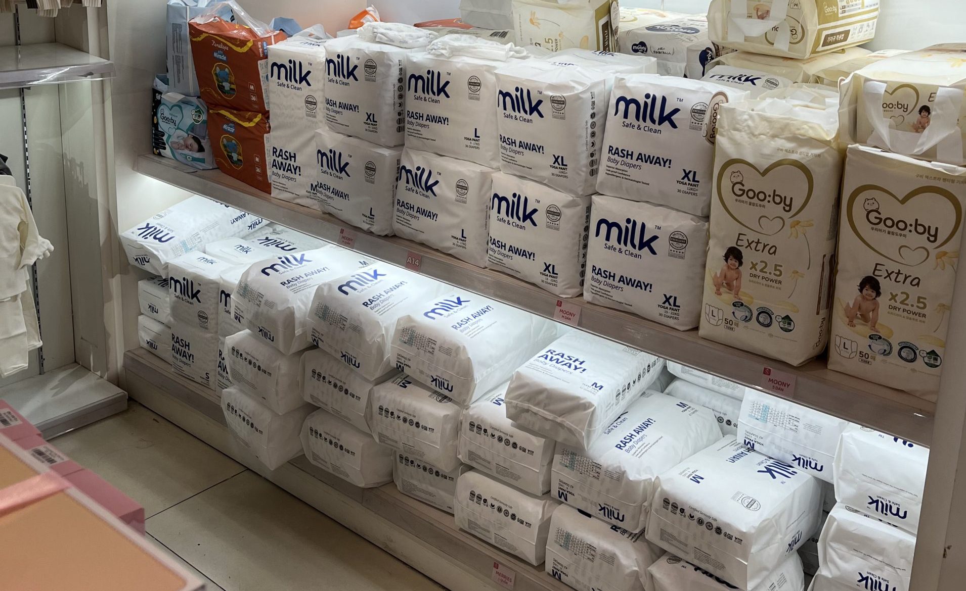 baby shop filled with white baby diaper packaging