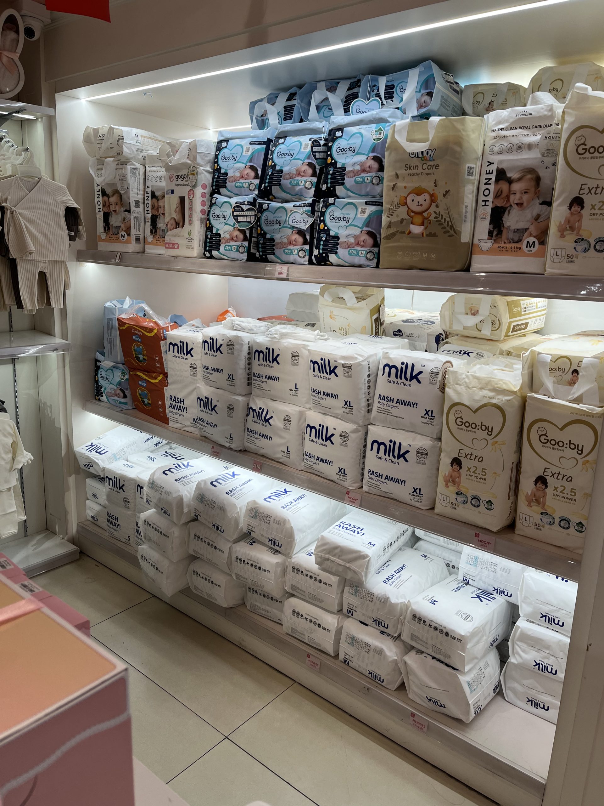 baby shop filled with white baby diaper packaging