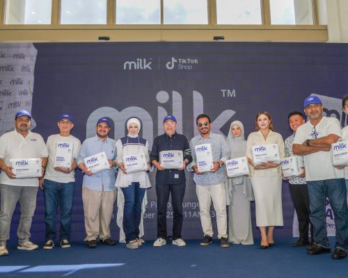 A group of celebrities holding MILK white diaper packs