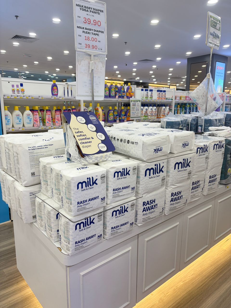 Island display of MILK diapers on shelves