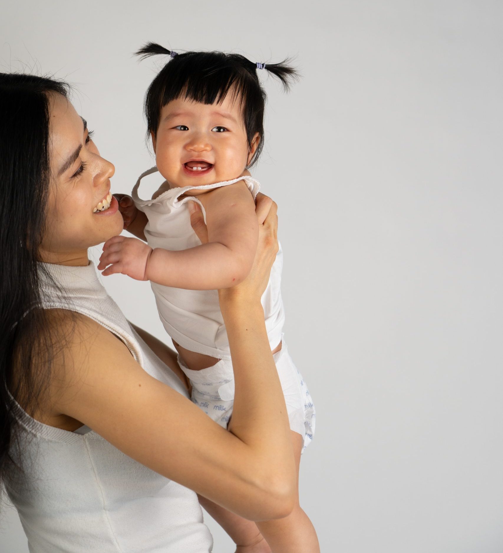 Happy mum holding her child